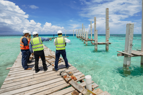 Workers on a beach - Open Knowledge - Inter American Development Bank - IDB